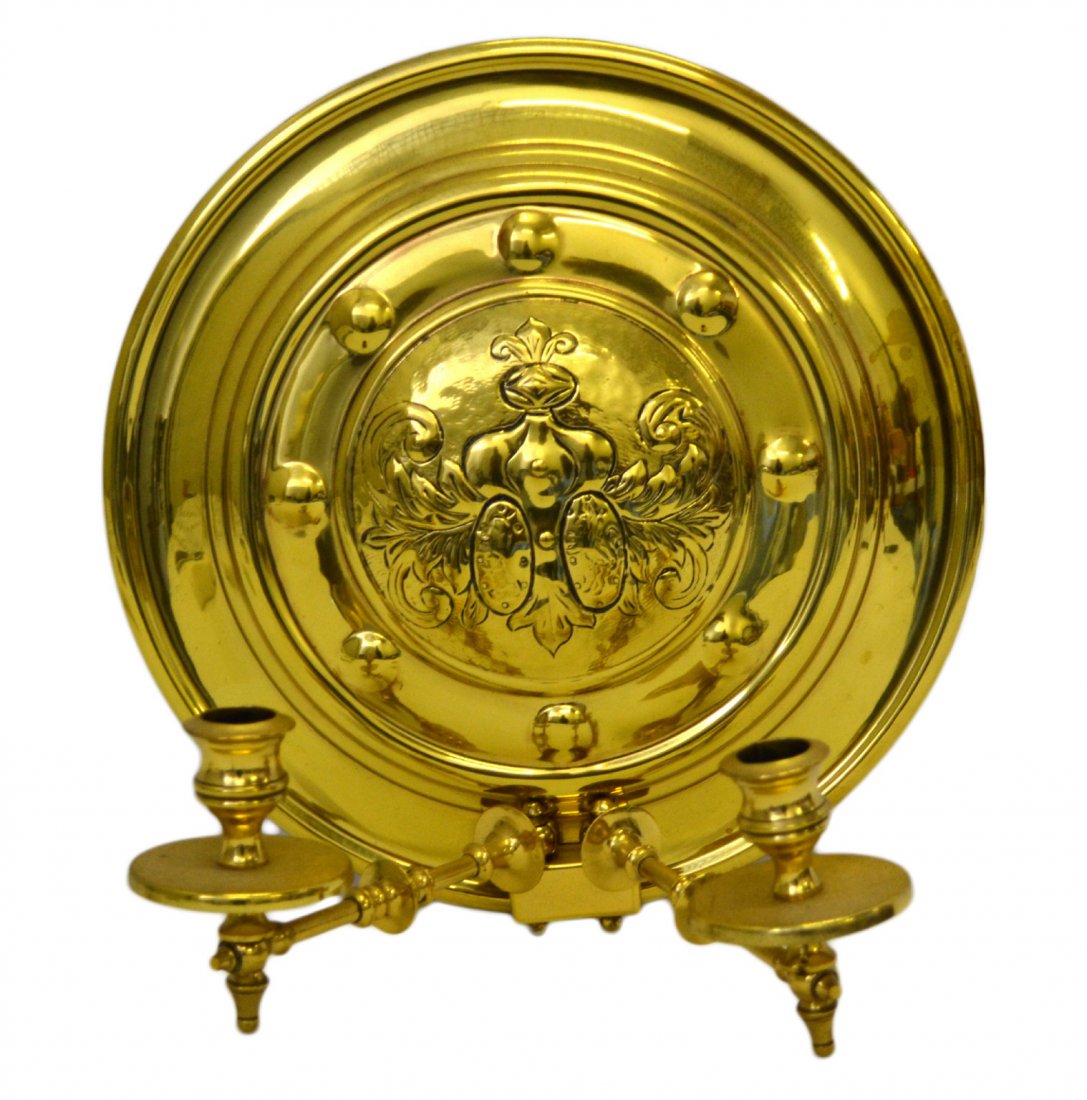 Wall sconce, two-light, brass, late 19th C: Wall sconce, two-light, brass, late 19th C Wall Sconce Material: Brass Construction: Stamped back, cast arms & candleholders Features: Two candle holders with moving arms. Scroll and foliate engraved.