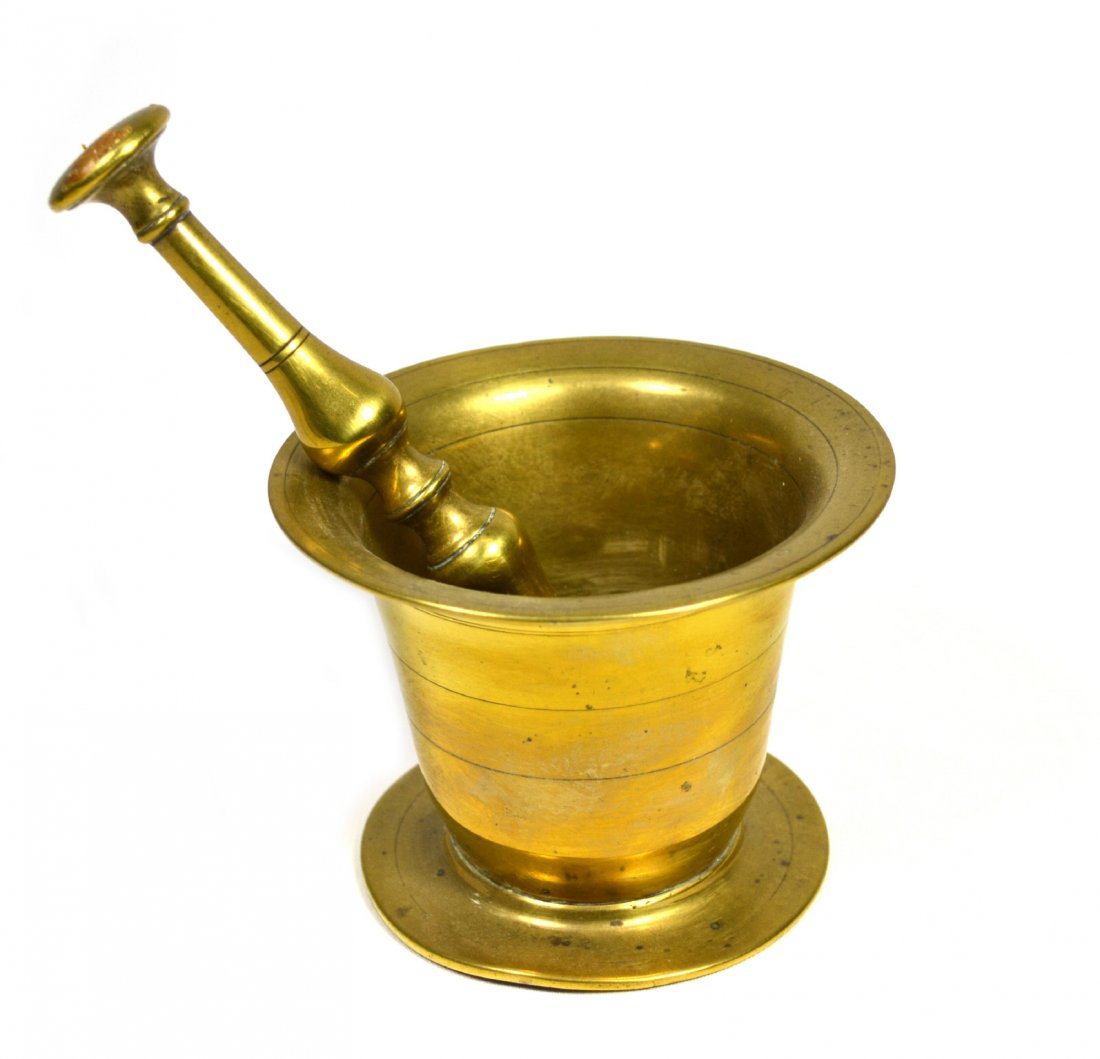 Mortar & Pestle, English, Brass, 19th century: Mortar & Pestle, English, Brass, 19th century Mortar and pestle Material: Brass Construction: Cast and turned Features: Lathe turned and decorated with scribe lines. Period: 19th century. Size: 3.75" 