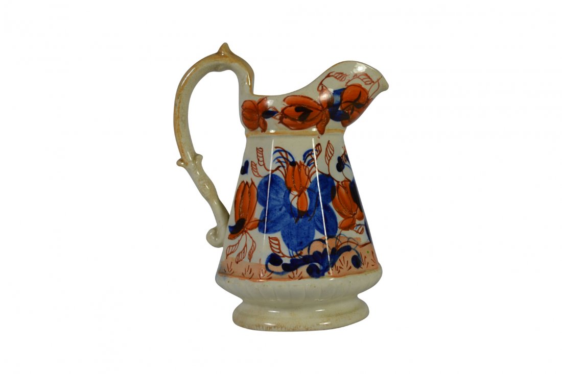Pitcher, Gaudy Welsh, Ironstone, Circa 1810: Pitcher, Gaudy Welsh, Ironstone, Circa 1810 Form: Pitcher Components: Hard paste Decoration: Hand painted floral and foliates. Colors: Orange and blue Markings: Marked on bottom 'Ironstone China' Date