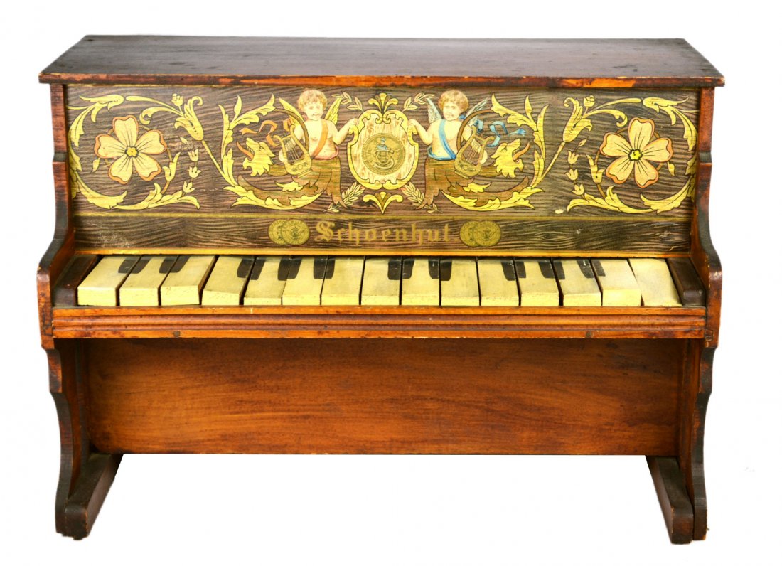 Child Piano, Schoenhut, c.1900: Child Piano, Schoenhut, c.1900 Childs piano Maker: Schoenhut Materials: Wood. Construction: Joined with finishing nails. Labels/Tags: 'Schoenhut' Age: Circa 1900. Description: The upper panel depicts 