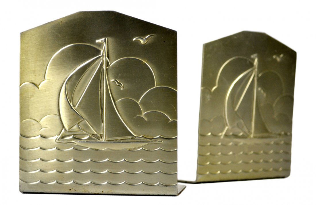 Bookends, Ship, Deco: Bookends, Ship, Deco Form: Ship at sail on water Material & Finish: Aluminum Construction: Stamped Maker & Markings: None Size: 4 1/8" H x 4" L x 2.5" D Weight: 4oz Condition: Very good. Some minor sc