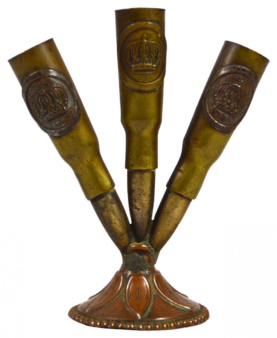 Cigarette Holder, German, Bullet Shells: Cigarette Holder, German, Bullet Shells Cigarette holder Material: Brass, metal Construction: Welded Marks: German crown Colors: Brass, bronze Features: Soldier made,Trench art, three brass bullet she