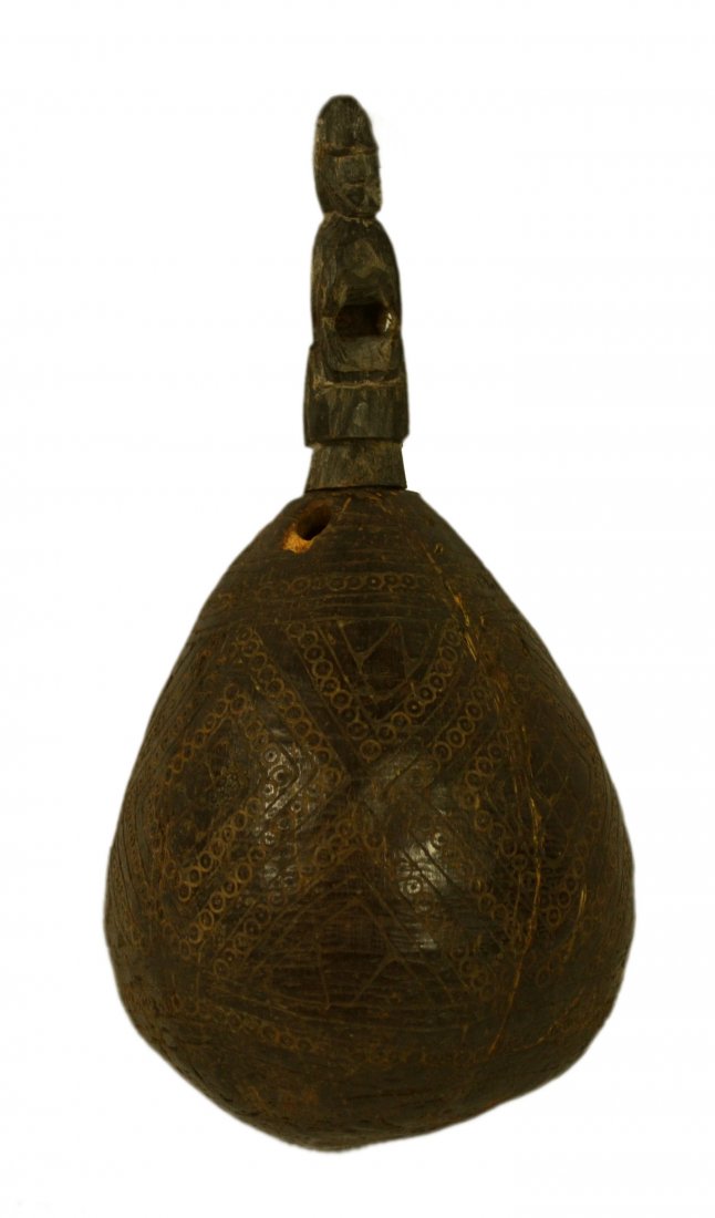 Flask, coconut, carved crouching figure,: Flask, coconut, carved crouching figure, Flask Material: Coconut and horn stopper Maker & Markings: Lightly incise engraved geometric pattern with lines of circles are placed on a small but dense coco