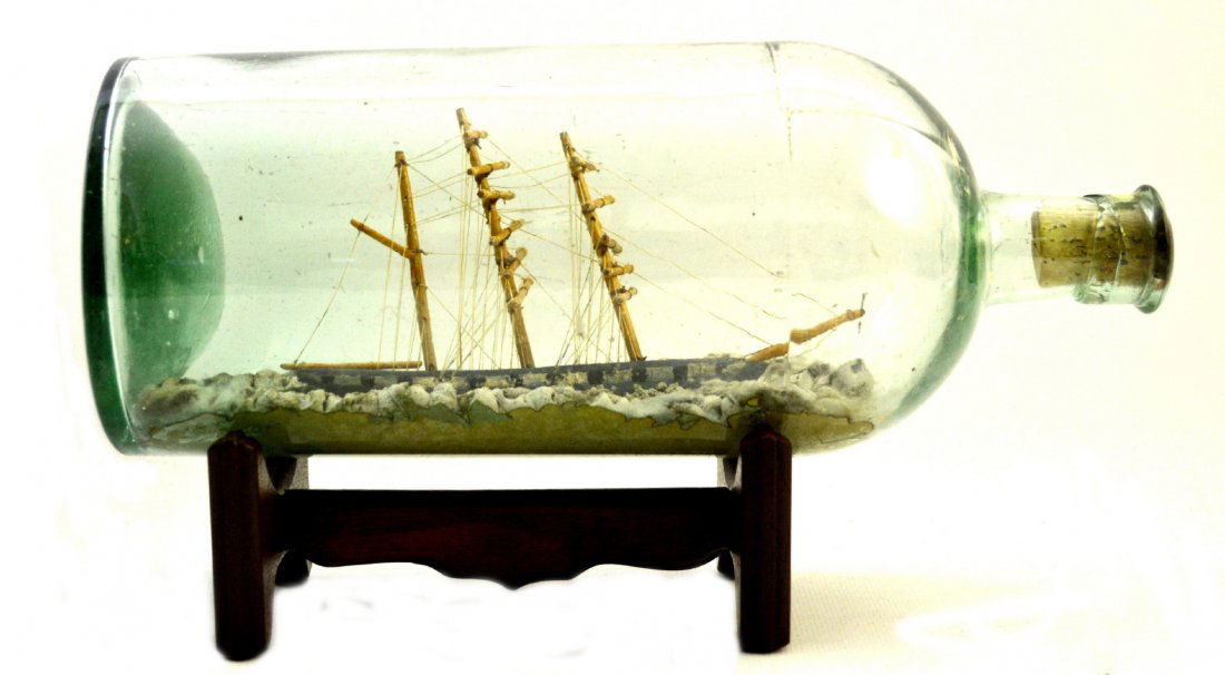 Ship In a Bottle, Bark w/ptd portholes, c. 1890: Ship In a Bottle, Bark w/ptd portholes, c. 1890 The Vessel Name: None Country of Origin: ? Type: Bark Hull: Blue, white and black Rigging: Simply rigged Deck Furniture: None Decoration: Painted portho