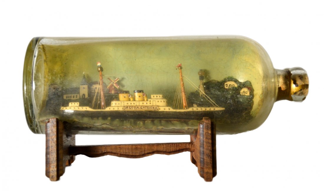 Ship In a Bottle,'Jacoba Catriena', c. 1920: Ship In a Bottle,'Jacoba Catriena', c. 1920 The Vessel Name: 'Jacoba Catriena' Country of Origin: France Type: Steam Ship Hull: Black and White Rigging: Two spar mast Deck Furniture: Deckhouses, 1st c