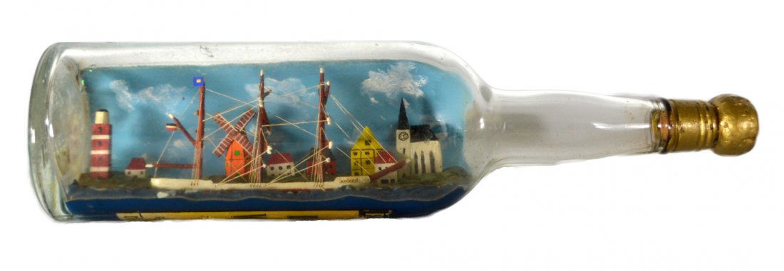 Ship In a Bottle, "Roland", c. 1950: Ship In a Bottle, "Roland", c. 1950 The Vessel Name: 'Roland' Country of Origin: Germany Type: Bark Hull: Red and white Rigging: Simply Rigged Deck Furniture: Skylights Decoration: At the top of the m