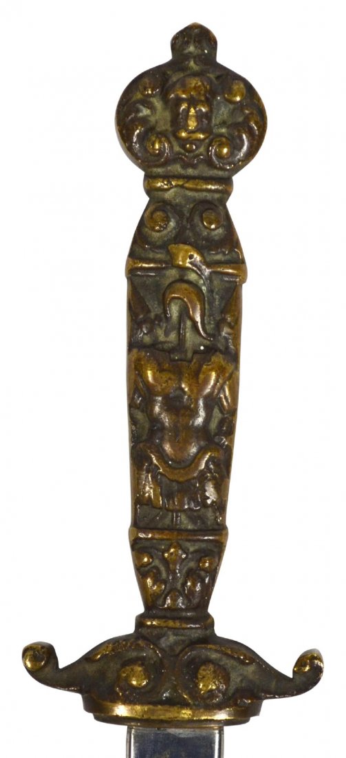 Dagger w/ Sheath, Brass, Late 19th Century: Dagger w/ Sheath, Brass, Late 19th Century Dagger. Material: Brass and steel. Construction: Cast. Marks: None. Features: Grip, pommel, cross guard and sheath are all cast from brass. The grip depicts