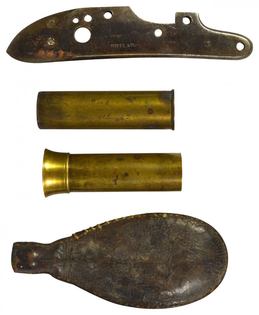 (4) Shot bag, Bullet Shells,CW Musket Lock Plate: (4) Shot bag, Bullet Shells,CW Musket Lock Plate Bag, shell, lock plate Age: 19th century Maker: Winchester, Various Materials: Brass, iron, leather Marks: Winchester Description: Four piece lot,# 1,