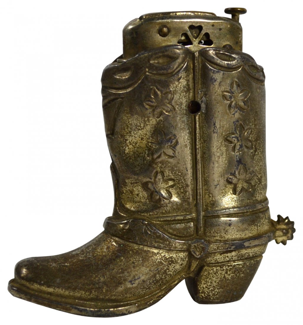 Lighter, Cowboy Boot, Occupy Japan: Lighter, Cowboy Boot, Occupy Japan Lighter. Age: Circa 1950. Materials: Silver plate. Marks: "Made in Occupied Japan". Construction: Cast. Description: In the form of a cowboy boot with a spur. Proven
