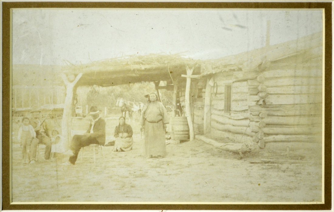 Photo, Indian Family, Log Home w/grass roof: Photo, Indian Family, Log Home w/grass roof What Is It? Age Circa 1890 Size 4.25" H x 7.25" W Weight 1 lb. 3 oz. Maker Unknown Frame/Mat Size 10" H x 12" W Description Log cabin with Indian family out