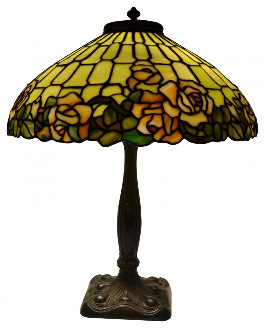 Lamp, Duffner & Kimberly, Rose, c. 1910: Lamp, Duffner & Kimberly, Rose, c. 1910 Lamp. Maker: Duffner & Kimberly. Age: Circa 1910. Description: Shade displays a rose pattern along lower edge. Colors consist of amber, cream, mauve, blue and g