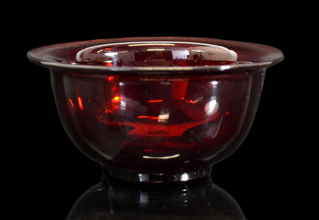 Bowl, Chinese Peking Glass, Ruby Red, Qianlong: Form: Bowl Colors: Transparent Ruby Red Marks: Incised Qianlong mark on base. Period: Qing Dynasty Provenance: Ina & Sandford Gadient Collection Size: 2.5" H x 5.25" Diameter Weight: 11 oz Condition: