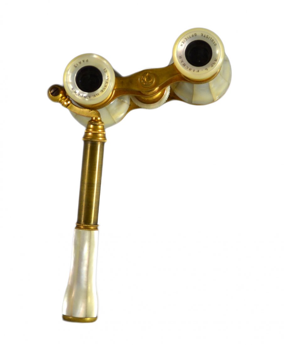 Opera Glasses, Mother of Pearl, 19th c.: Binoculars Material: Mother of Pearl Marks: Paris, Mon L. Fischer Features: Binoculars. Mother of Pearl throughout body of item. Has handle and an adjustable focusing knob. Inscription " Mon L. Fisher