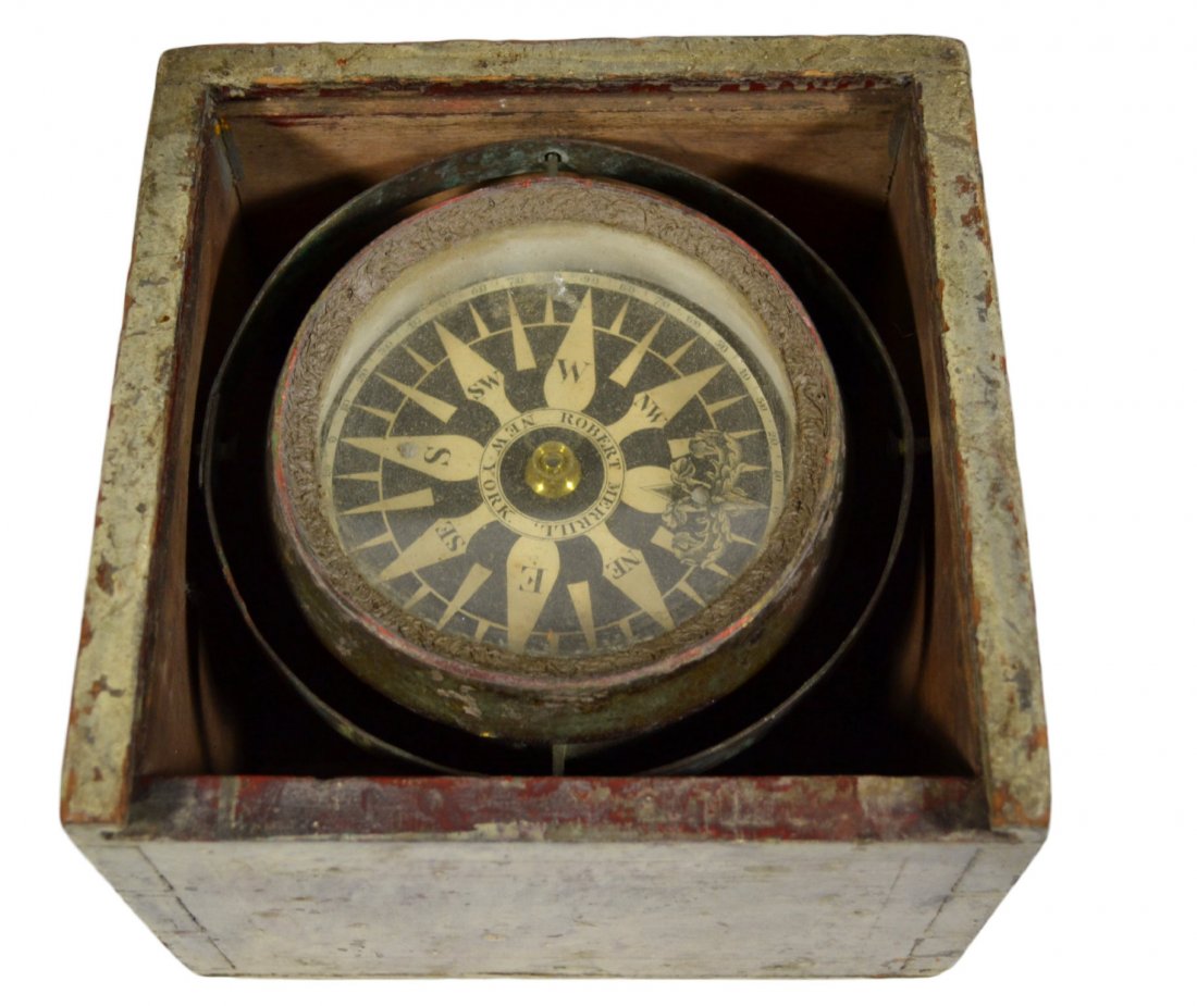 Ships Compass, Robert Merrill C. 1850: Ship compass Material: Wood Description: The compass card reads "Robert Merrill New York." Construction: Dovetailed Date: Circa 1850 Size: 5.5" H x 7.5" W x 7.5" D Weight: 3 pounds Condition: Painted 