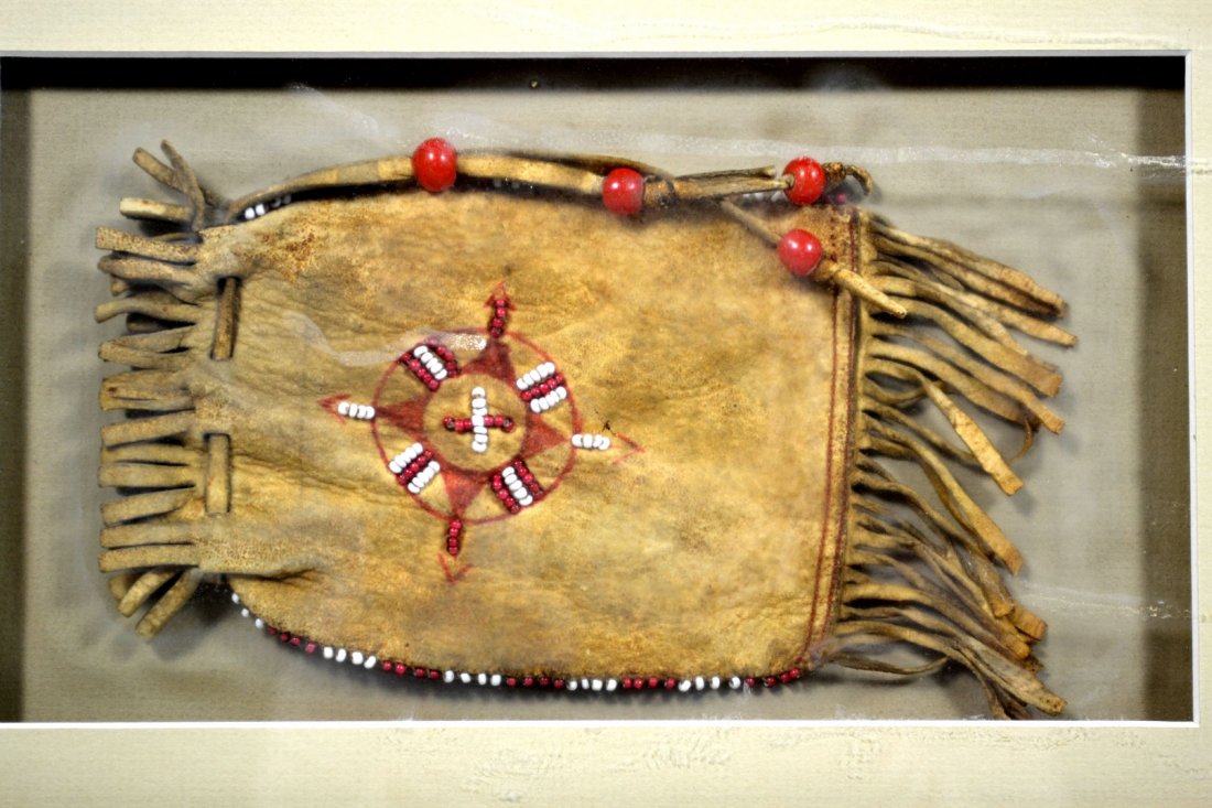 Medicine Bag, Beaded, Native American Indian: Medicine Bag Materials: Leather with beads Age: Late 19th / Early 20th C. Description: The center has beaded and painted decoration. The sides are also beaded. Red stitching along bottom. Size: Framed
