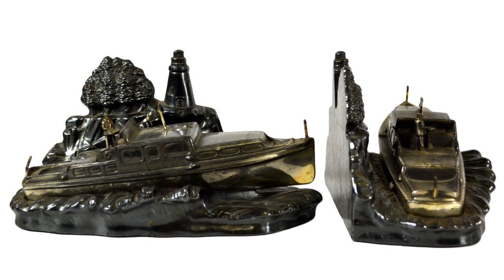 Ship Bookends, Jennings Bros. Rare, c.1930: Bookends Pair of Bookends Form: Ship Material & Finish: Silver Finish Features: Motor yacht, background lighthouse Maker & Markings: JB 278 on side base Size: 3.5"H x 7"W x 3.8"D Weight: 4.8 Condition