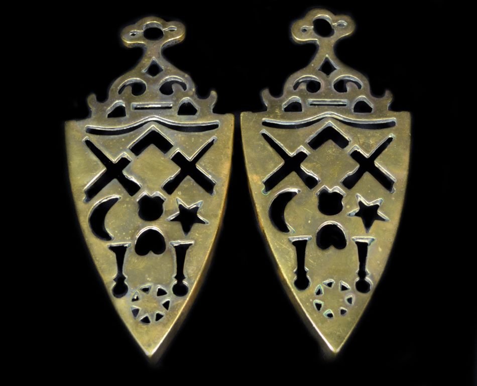 Trivets, Pair, English Brass, C. 1860: Pair of trivets Material: Brass Construction: Cast Features: A pair of English brass trivets. Period: c. 1860 Size: Each: 1" H x 8.25" W x 3.75" D Weight: 1.5 pounds each Condition: Light wear. Histor