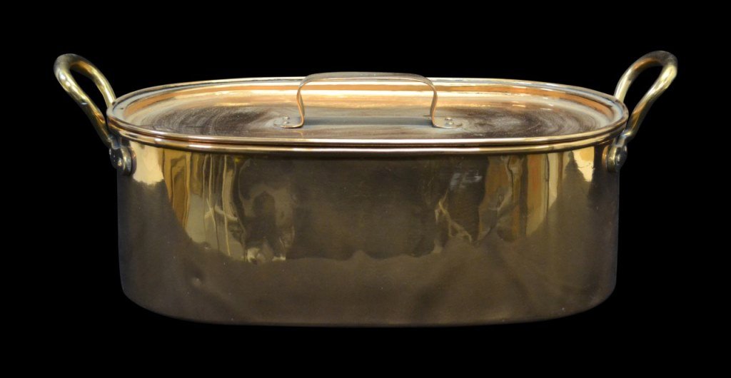 Copper Fish Poacher, Large, 19th c.: Fish Poacher Material: Copper Construction: Cast Features: Copper Fish Poacher with lid and handles. Period: 19th c. Size: 6.6"H x 18"W x 12"D Weight: 13.2 lb Condition: Light wear. History: Provenanc