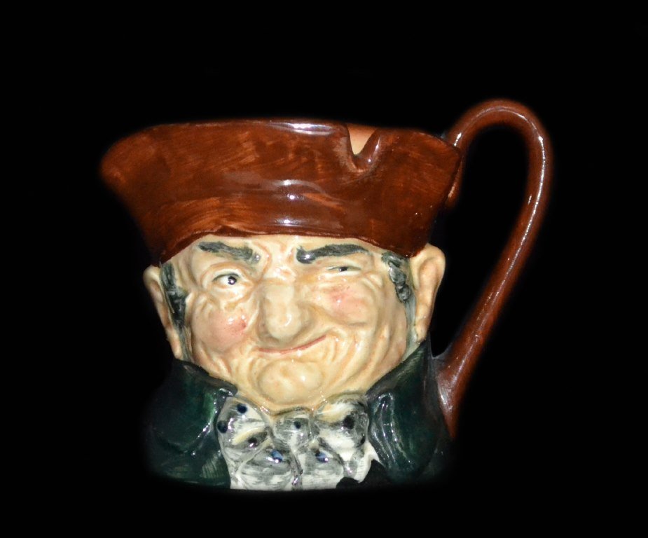 Mug, Toby, Royal Doulton, "Old Charley" c.1932: Form: Mug Components: Hard Paste Decoration: Mug depicts a man squinting. Inscription "Old Charley." Colors: Brown, Green Markings: "Royal Doulton England" "A" Date: c.1932 Provenance: The estate of A