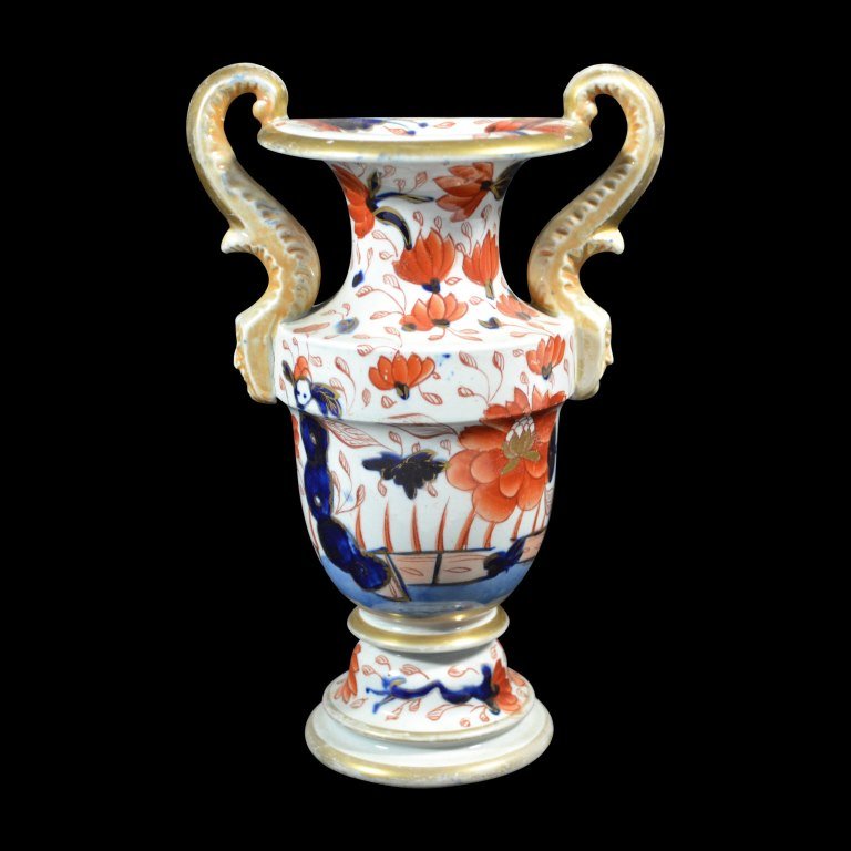 Vase, Mason Ironstone, C. 1820: Form: Vase Components: Hard paste Decoration: A hand painted Mason Ironstone vase depicting flowers with gilt highlights. Colors: Gold, blue, and orange Markings: None Date: c. 1820 Provenance: The es
