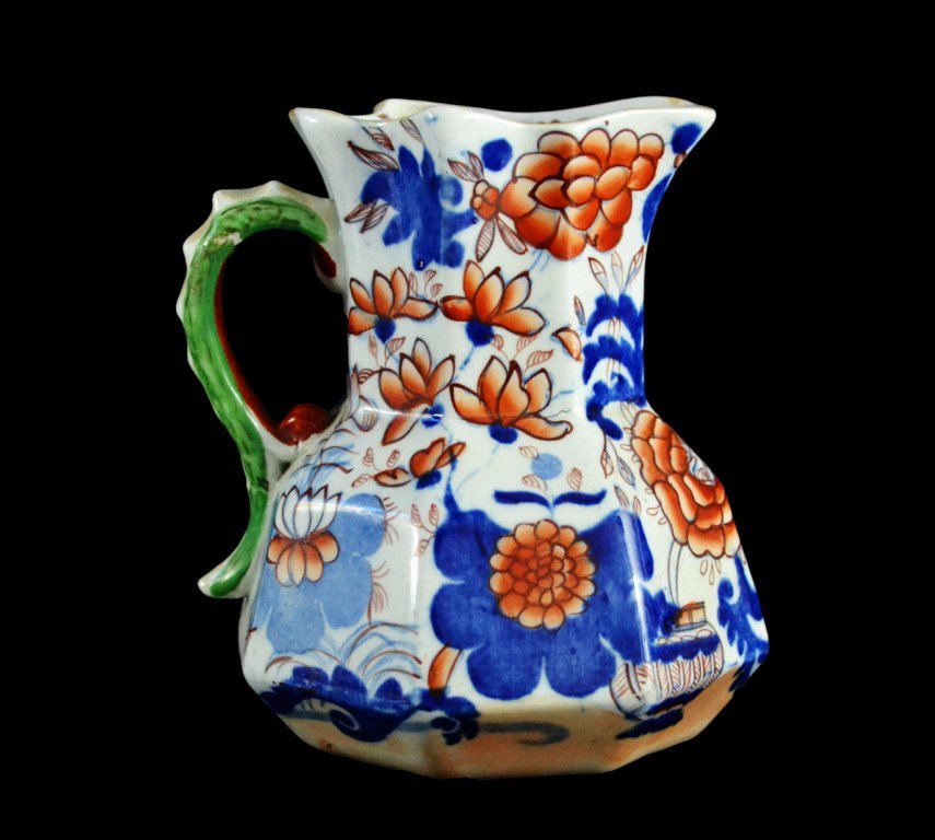 Pitcher, Mason Ironstone, C.1825: Form: Pitcher Components: Hard Paste Decoration: Decorated in the Japanese pattern depicting flowers and having a serpent handle. Colors: Blue, orange, green & red Markings: Masons Ironstone mark on b