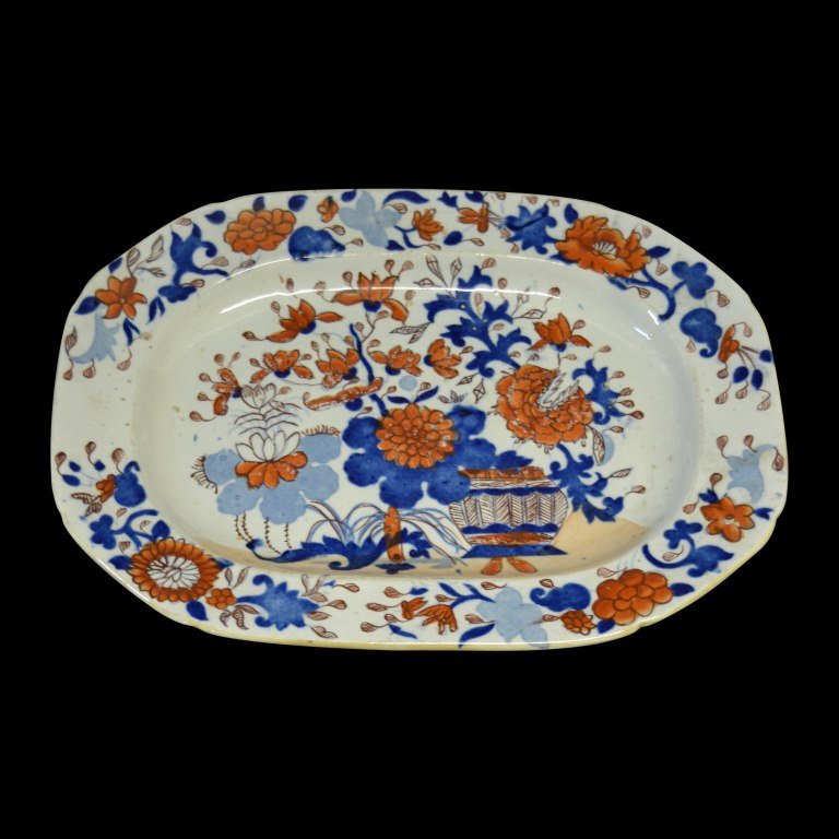 Platter, Mason Ironstone, C. 1810-25: Form: Platter Components: Hard Paste Decoration: Hand painted platter depicts lotus flowers. Colors: Blue & red Markings: Impressed mark on base Date: c. 1810-25 Provenance: The estate of Arthur J. Co