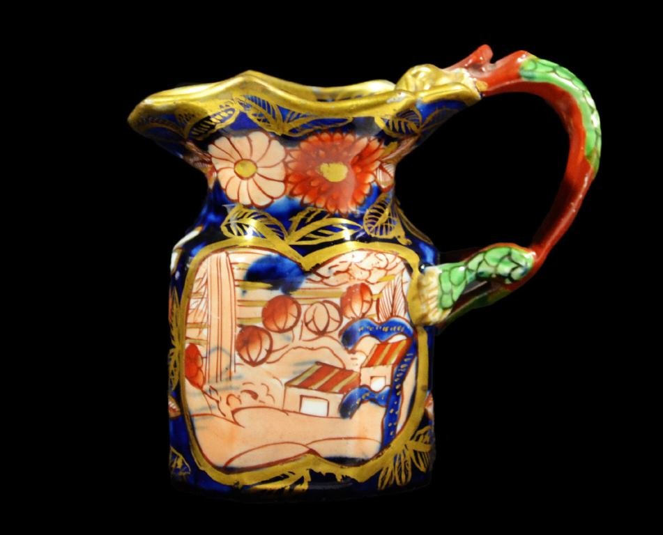 Jug, Mason Ironstone, Schoolhouse, Early 19th C: Form: Miniature Jug Jug Components: Hard Paste Decoration: A small Mason's ironstone jug, decorated with Oriental sprays and with full dragon handle. Hand painted. Marked "2" on bottom. Colors: Blue, 