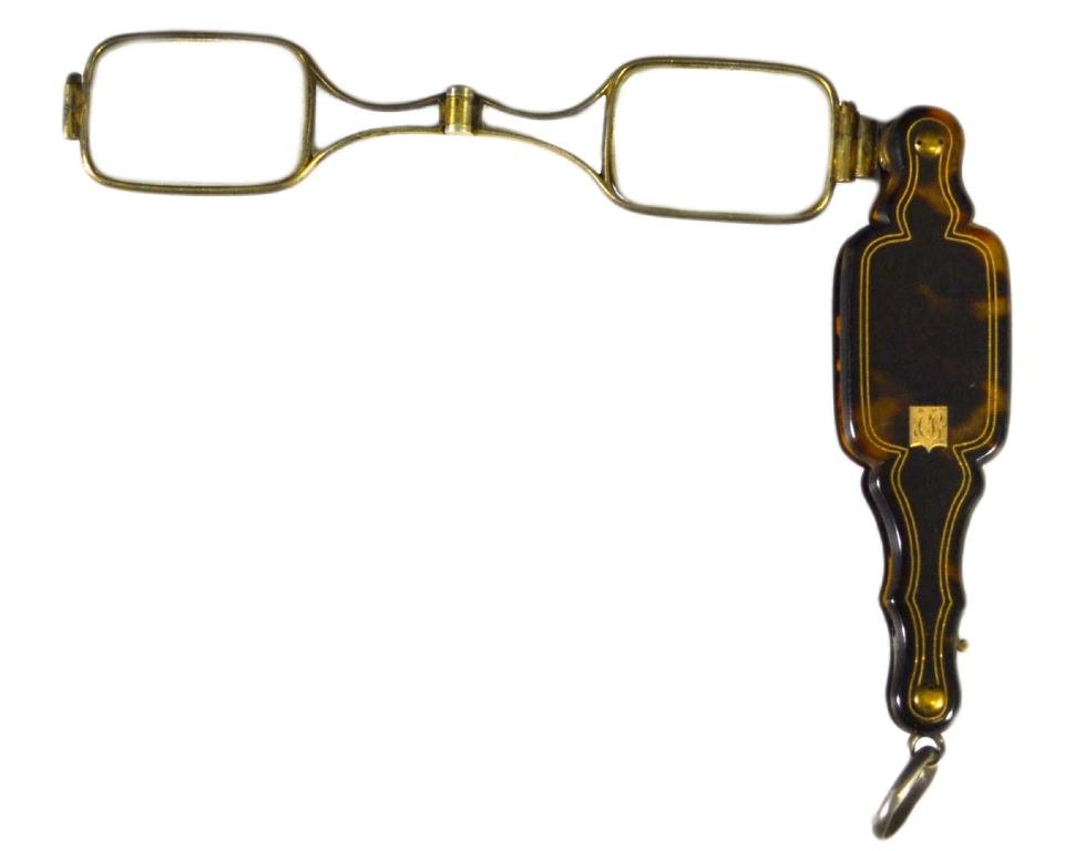 Lorgnette, Tortoise, Folding Spectacles, 19th C.: Lorgnette Material: Tortoise Shell Construction: Hinged Marks: None Colors: Brown Features: Tapered tortoise shell handle, with inlaid vacant cartouche and folding oval-shape spectacles having inlays 