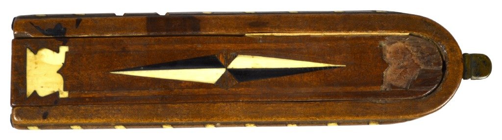 Tobacco/Snuff Grater, Ebony, Ivory,18th Century: Nutmeg grater Material: Mahogany,ebony,ivory Description: Tobacco grater of contrasting color woods of mahogany and ebony, with ivory and ebony inlays in a chevron decoration on lid and bottom. Scoop