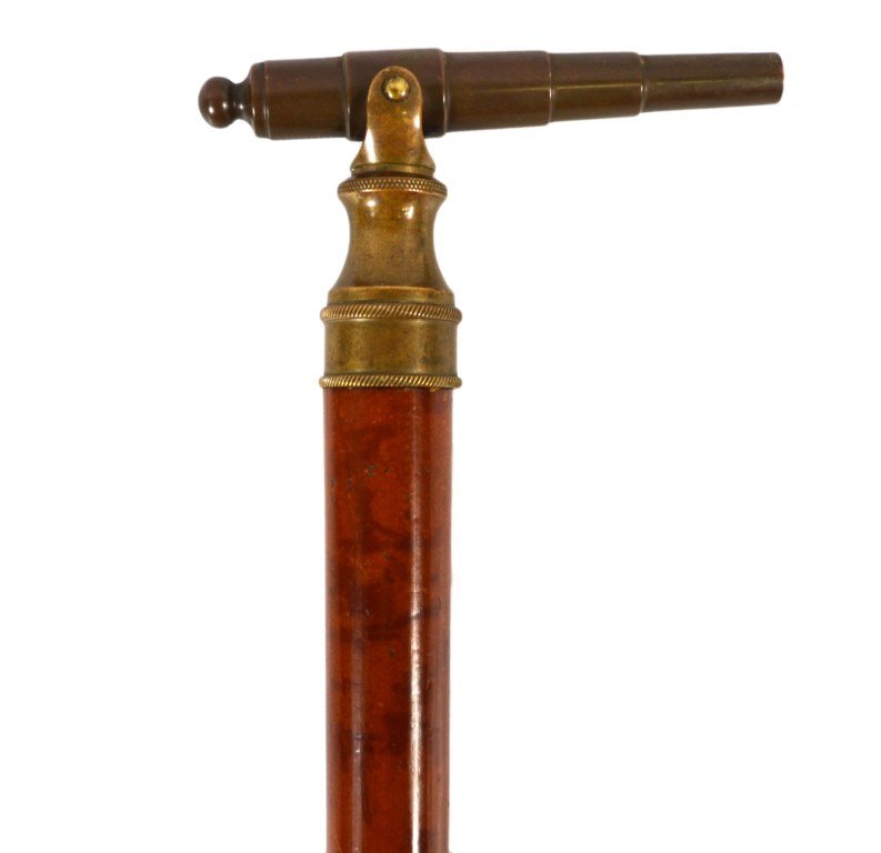 Cannon Top Cane, .38 Cal, 19th Century: Cannon top cane Materials: Brass and wood Date: Circa 19th Century Description: Cannon top cane is capable of firing a .31 caliber ball. Add powder, point cannon, and light up the touch hole to fire. 