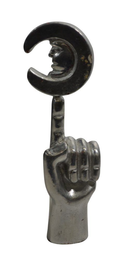 Friedeberg, Man in Moon/Hand, Silver 7.5": Mand in Moon/ Hand Age: 20th C Materials: Wood Marks: Pedro Friedeberg Country of Origin: Mexico Description: Man in Moon/ Hand Size: 7.5"H x 2.5"W x 1.25"D Weight: < 1 lb Condition: Light discolorati