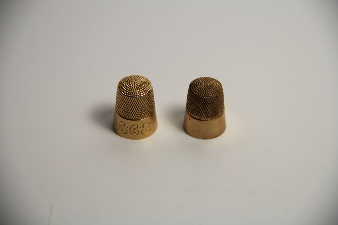 Two Gold Thimbles, Brock&Co, C. 1900: Pair of gold thimbles Description: This pair of thimbles each come in their original boxes, resting on cloth cushions within the confines of their containers. The boxes themselves consist of a cardboa