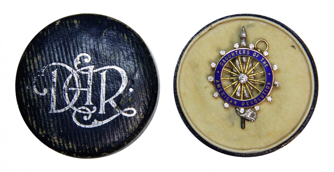 Pin, D.A.R., Diamonds, 20g, Evelina Hamilton: D.A.R.,Evelina Hamilton's Description: This pin belonged to Evelina Hamilton and is an official pin of the Daughters of the American Revolution, completely surrounded by 13 diamonds. A single, larger