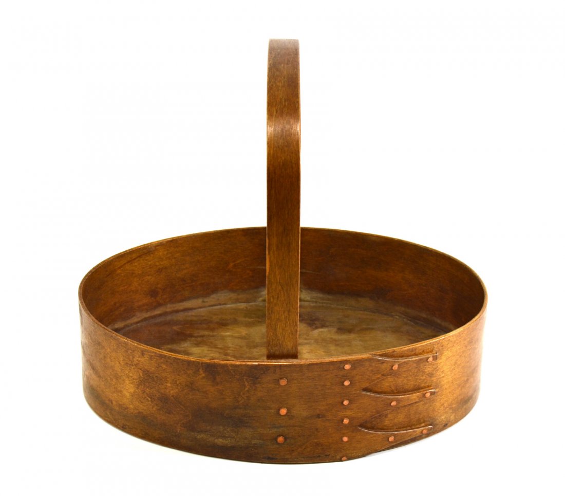 Basket, shaker style wood-carrying, 19th C: Form: Oval Age: 20th century Size: H. 11 x W.12 x D.9" Weight: 1.5 pounds Materials: Birch Provenance: Florida estate Description: Bent wood handle is fastened to a body constructed of birch. The bask