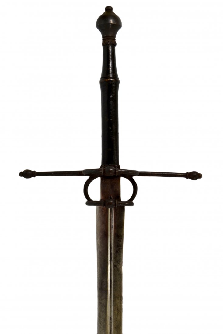 Sword, Hand & Half, 17th Century: Sword Material: Steel and leather Construction: Forged Marks: None Features: A hand and half sword with cross guard having a double ring guard to each side. Leather wrapped handle has steel braid wrap