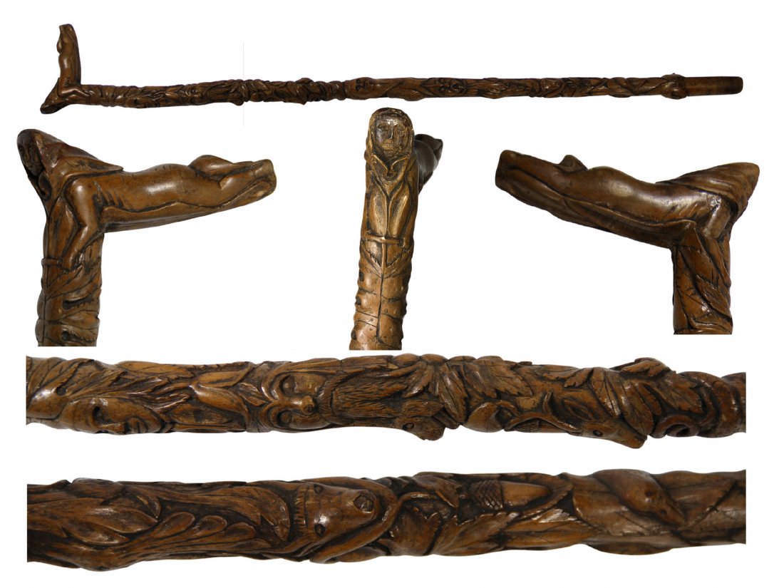 Cane-The Best! Black Forest/Brienze cane, 19thC: Cane/Walking stick Materials: Walnut Construction: Carved one piece Date: 19th century Description: A woodlands cane likely Black Forest with seven integrated portraits, seven animals, an entwined ser