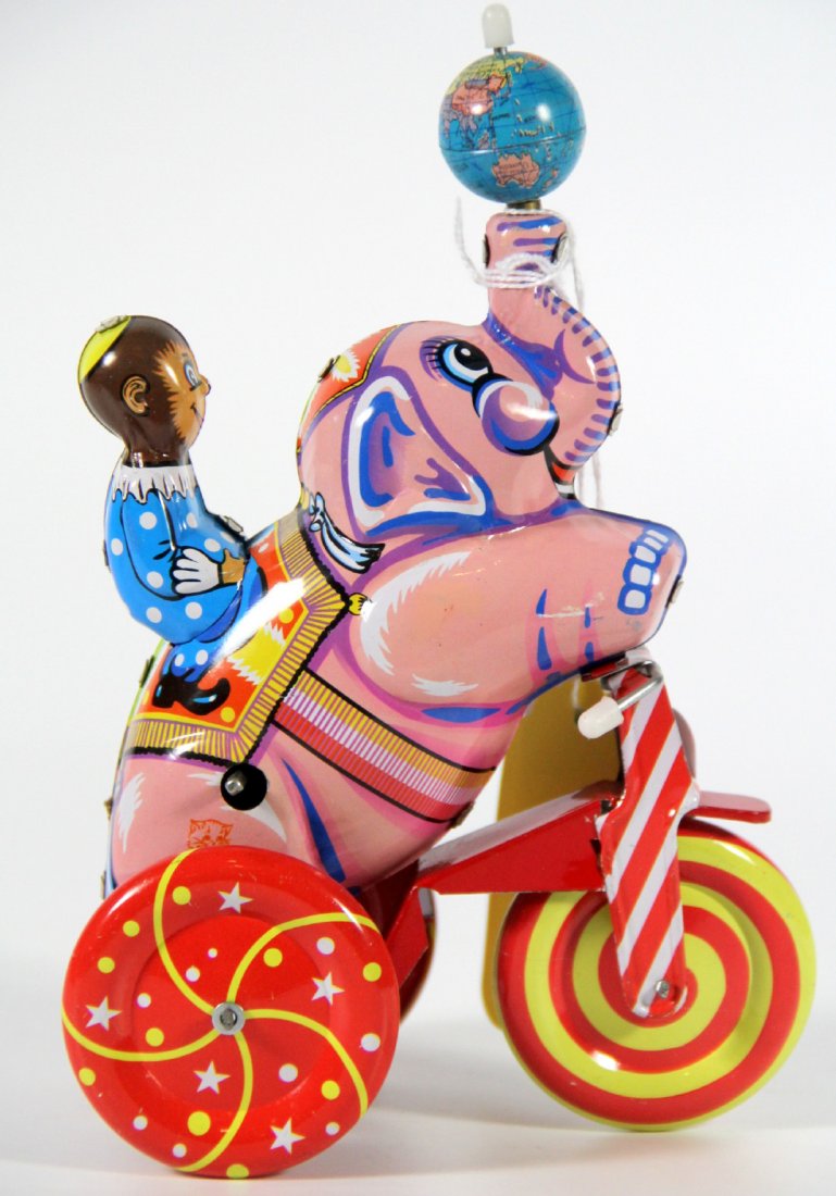 Toy, Tin Circus, Monkey/Elephant, China-1980: Tin Toy Maker: unknown Materials: Tin Labels/Tags: stamped Made In China w/cat head Age: 1980 Description: tin circus toy on wheels. Monkey sits on the back of an elephant and the elephant balances a