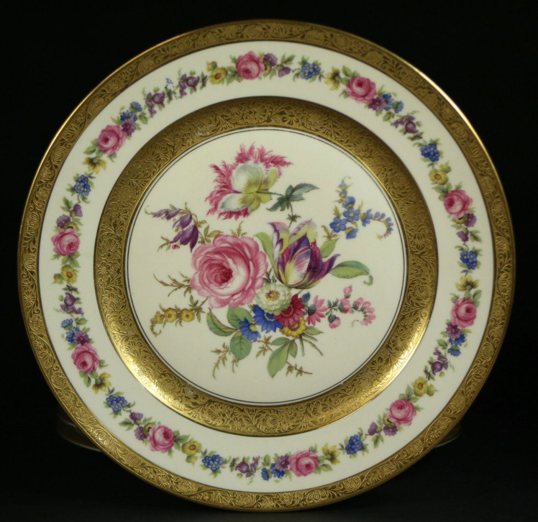 (12) Rosenthal Ivory plates, Circa 1930: Description: A 12 piece set of porcelain Rosenthal Ivory plates with a floral pattern in the center and border. There is also a raised gold leaf trim in the center and on the edge of the plate. The Ro