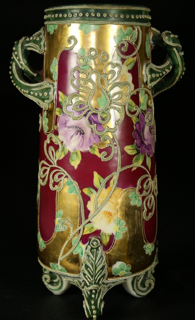 Vase with handles, porcelain, c.1900: Description: A double handle, footed porcelain vase, hand painted with flowers, hand decorated, raised detail work & gilding. In the style of Nippon. Material: Porcelain Maker/Artist: Unknown Date: Ci
