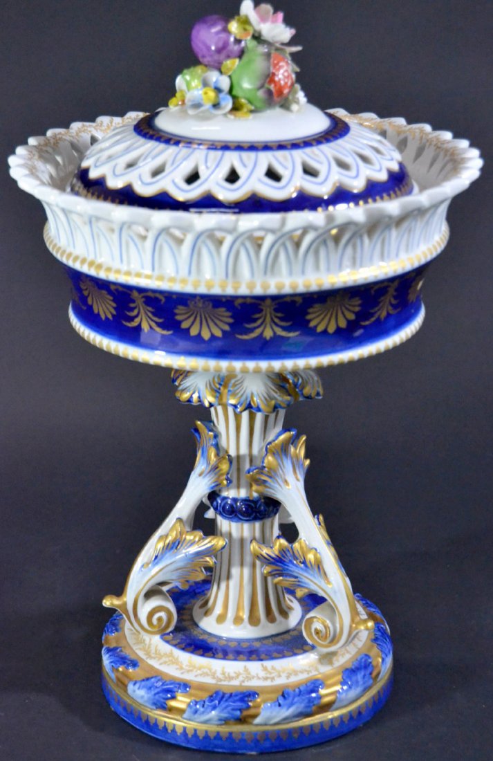 Covered Compote, 20th century: Description: A Sevres porcelain compote, hand painted with gilt. The lid have a fruit and flower top. The double L mark is on the bottom. Material: Porcelain Maker/Artist: Sevres Date: 20th century Pr