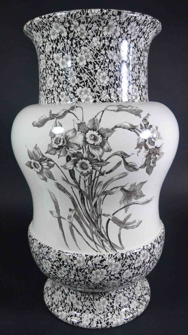 Vase, 24" Doulton, Burslem Transfer Printed: Description: Transfer printed with a day lilly pattern and an additional flower pattern banding the top & bottom. Material: Porcelain Maker/Artist: Doulton Burslem Date: Unknown Provenance: Whitenac