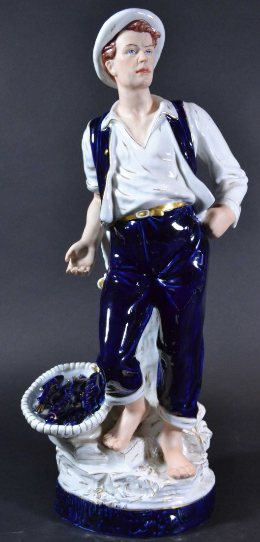 Royal Dux Bohemian of man with fish basket, c1900: Description: Hand painted blue and white with gilt decoration. Marked. Material: Porcelain Maker/Artist: Royal Dux Date: Circa 1900 Provenance: Whitenack estate of Naples, Florida Size of Ar