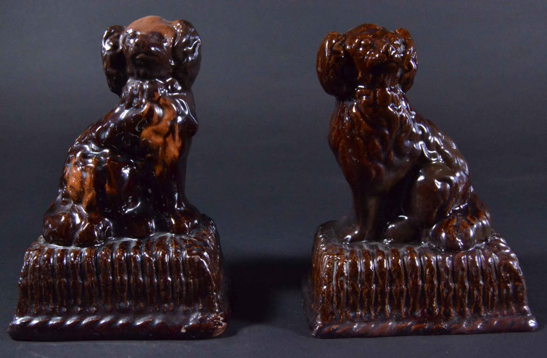 Earthenware Dogs (2) Spaniels, Glazed c1880: Description: Brown glazed Spaniels, c. 1880, a near pair.Earthenware spaniel dogs with brown glaze. England 19th century. Material: Earthware Maker/Artist: Unknown Date: 19th C Provenance: Whitenac
