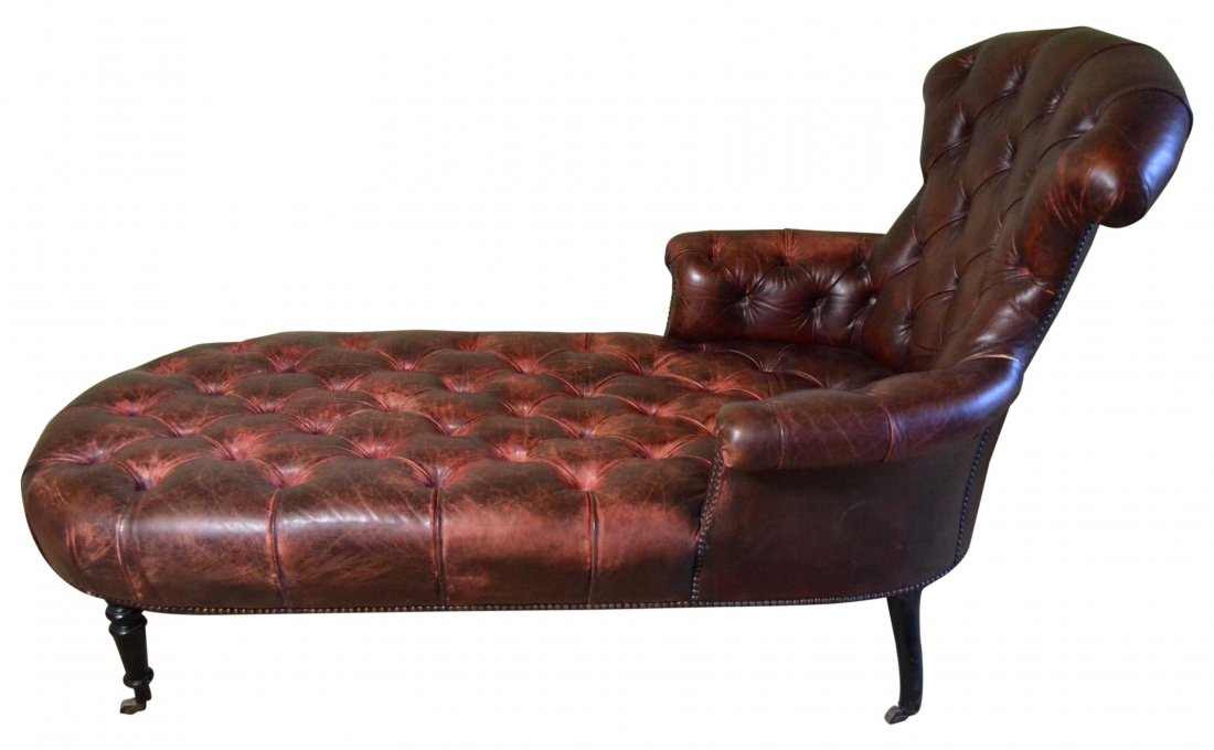 Antique day bed/ Chaise, 19th Century: Description: Turned and ebonized oak legs front with carved splayed legs rear, resting on turned hardwood casters. Tufted and stained red leather upholstery(new). Material: Leather Maker/Artist: Unkno