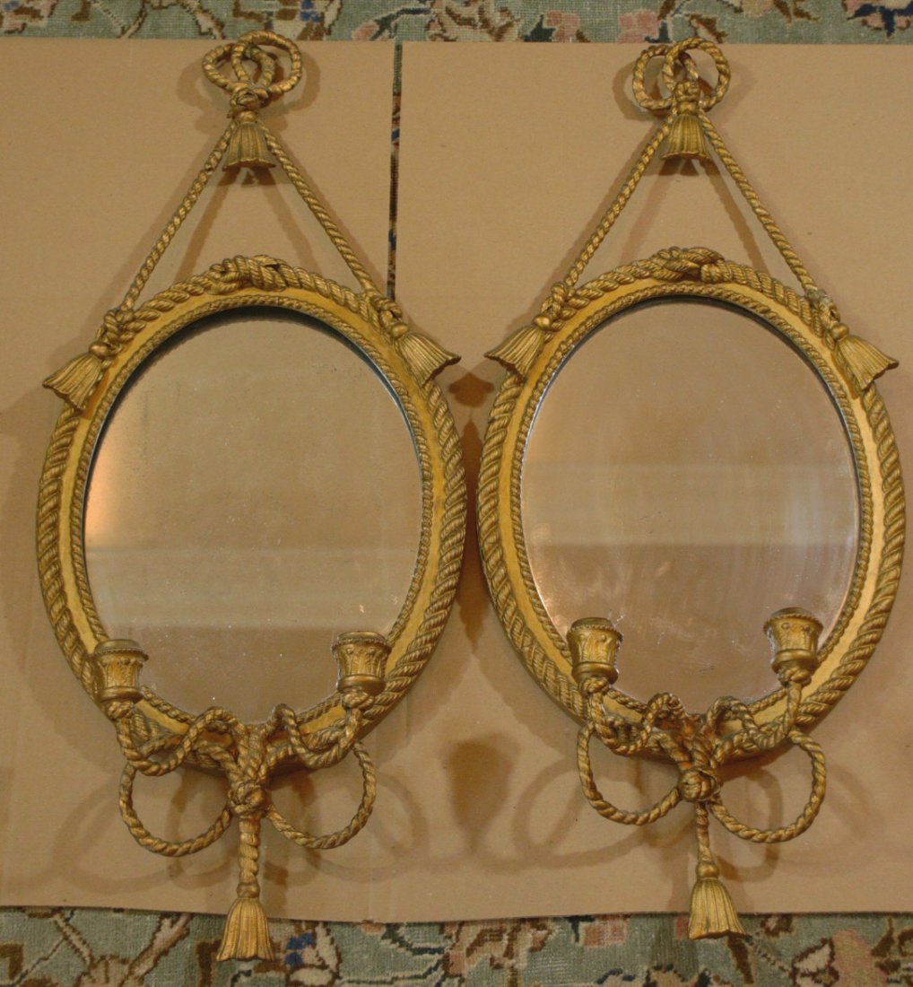 Pair of mirrors on original backboard. C1800.: Description: Pair sconce mirrors, circa 1800, rope design borders and candle sticks with a lace on top, made of gesso on wood, wire reinforced extensions and original glasses. Material: Glass, wood, g