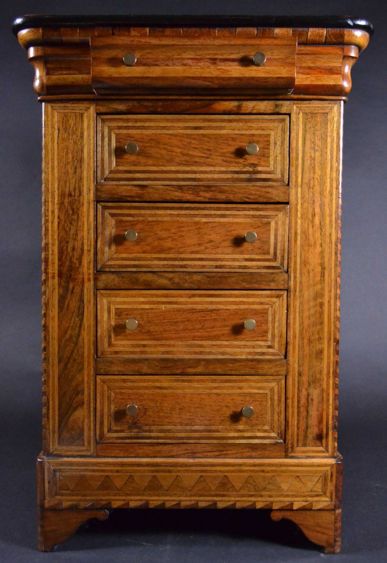 Miniature Chest. Circa 1850: Description: Exceptional Mahogany over hand planed pine. Veneers used are Mahogany, Rosewood, & Birch. Solid Mahogany (ebonized) top with feet of solid Mahogany and Rosewood. Material: Mahogany, Eboni