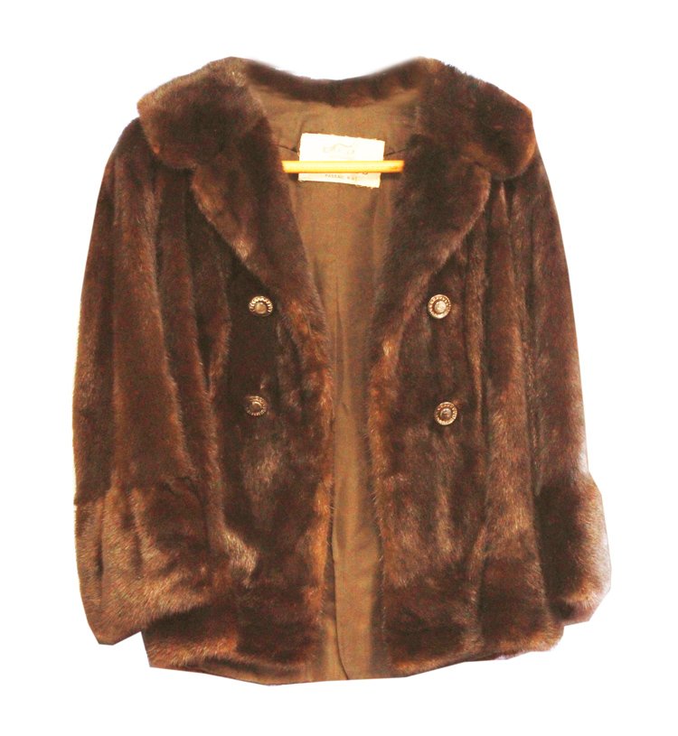 Fox fur jacket monogrammed: Description: A chocolate brown, ladies fox fur jacket, fully lined and monogrammed G S. Has buttons with hidden loop closure, the buttons have a grey color with a clear metallic design going around. M
