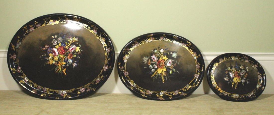 Nested set of trays, c. 1870: Description: Black lacquer, mother of pearl, paint and gilt on papier mache. Later mounted hooks for hanging on the reverse. Material: Papier mache, Mother of pearl Maker/Artist: Unknown Date: Circa 1