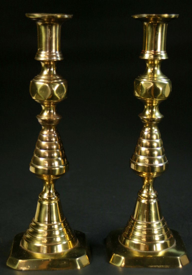 Pair English Brass Beehive Candlesticks, 9 3/4": Description: Pair of English brass beehive candlesticks. Square bases. Original push-ups intact. England stamped base. Material: Brass Maker/Artist: British school Date: Circa 1896 Provenance: Flori
