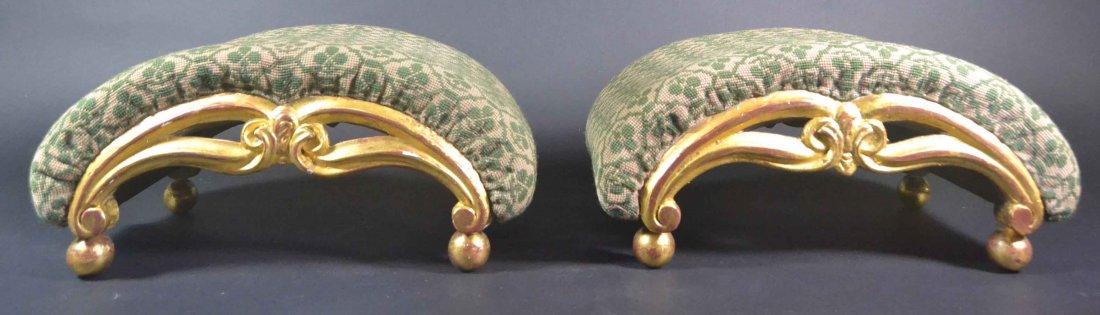 Pair gilt wood stools, c. 1840.: Description: Each curvilinear shaped top holstered top over horse hair with webbing. Fabric is woven wool in green & white. Carved and pierced arches resting on ball feet. Material: Woven Wool,Gillt w